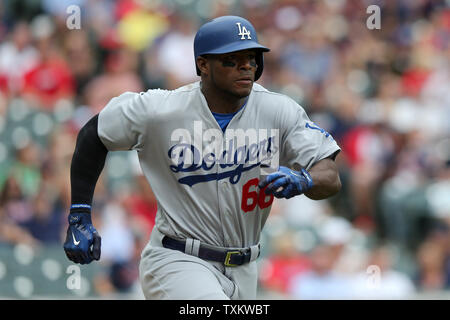 Cleveland Indians' Yasiel Puig runs to first during the fourth