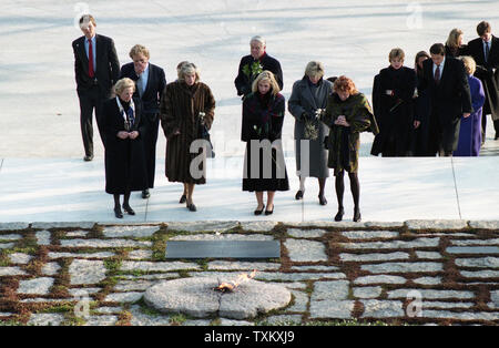 Hillary Clinton and members of the Kennedy family visit the John F. Kennedy grave site at Arlington National Cemetery in Arlington, Virginia on January 19, 1993. UPI Stock Photo