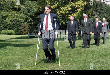 Vice President Al Gore walks across the South Lawn of the White House in Washington on crutches to attend a signing ceremony for the crime bill on September 13, 1994. UPI Stock Photo
