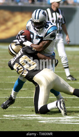 Carolina Panthers wide receiver Muhsin Muhammad is wrapped up by