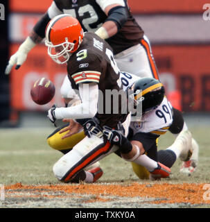 Cleveland Browns quarterback Charlie Frye (9) gets sacked for a