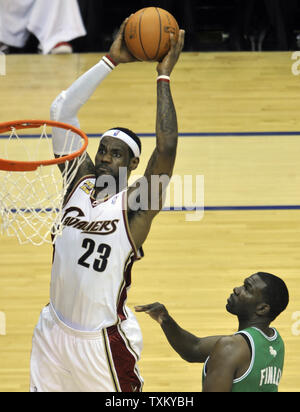 Cleveland Cavaliers LeBron James, left, goes up for a slam dunk beside Michael Finley against the Boston Celtics in game 2 of the second round of the NBA Playoffs in Cleveland on May 3, 2010.   UPI/David Richard Stock Photo