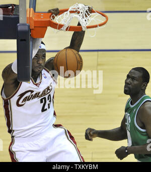 Cleveland Cavaliers LeBron James, left, goes up for a slam dunk beside Michael Finley against the Boston Celtics in game 2 of the second round of the NBA Playoffs in Cleveland on May 3, 2010.   UPI/David Richard Stock Photo