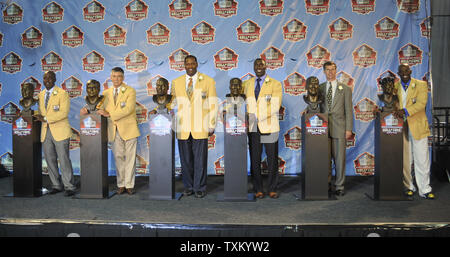 Former NFL player Bryant Young poses with his bust during an induction  ceremony at the Pro Football Hall of Fame in Canton, Ohio, Saturday, Aug.  6, 2022. (AP Photo/David Dermer Stock Photo 