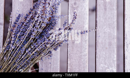 Dried lavender bunches on wooden table background Stock Photo