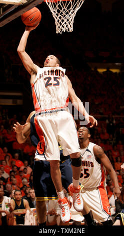 University of Illinois guard Calvin Brock (25) puts in a rebound against the University of Michigan at the University of Illinois Assembly Hall in Champaign, Il., February 21, 2007. The University of Illinois mascot Chief Illiniwek was retired by the University after the NCAA imposed sanctions for having a mascot portraying offensive use of American Indian imagery. (UPI Photo/Mark Cowan) Stock Photo