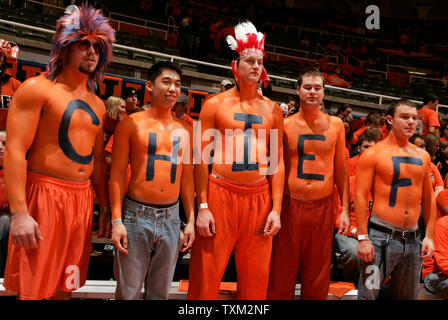 Members of the Illinois student fan section, the Orange Krush, spell out Chief before their game against the Michigan Wolverines at the University of Illinois Assembly Hall in Champaign, Il., February 21, 2007. The University of Illinois mascot Chief Illiniwek was retired by the University after the NCAA imposed sanctions for having a mascot portraying offensive use of American Indian imagery. (UPI Photo/Mark Cowan) Stock Photo