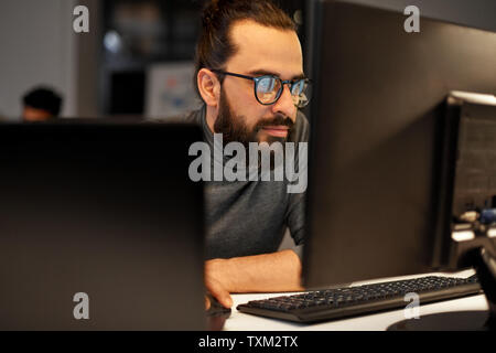 close up of creative man working at night office Stock Photo