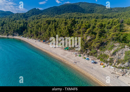 Tropical beach camping site in Chumphon Province, Thailand. Palm trees ...