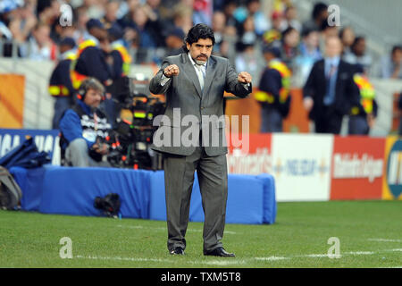 Argentina manager Diego Maradona watches the FIFA World Cup Quarter Final match at the Green Point Stadium in Cape Town, South Africa on July 3, 2010. UPI/Chris Brunskill Stock Photo