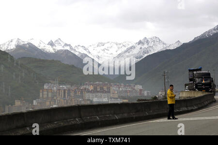 A newly built  city sits in a mountain valley as part of China's push to develop Kangding, a small county in the Ganzi Tibetan Autonomous Prefecture of Sichuan Province, on May 21, 2016.  China's central government is investing heavily in the development of the Tibetan Prefecture, building schools, roads, hydroelectric dams and general infrastructure projects.  The Tibetan area is normally off-limits to foreign journalists, with the Chinese government tightly controlling the prefecture's growth - which sometimes conflicts with the Tibetans' traditional way of life.      Photo by Stephen Shaver