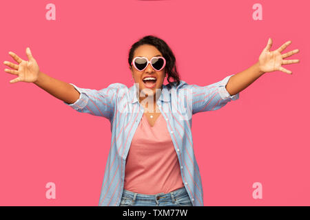 african american woman in heart-shaped sunglasses Stock Photo