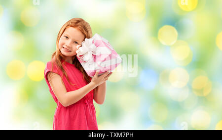 lovely red haired girl with birthday gift Stock Photo