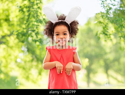 happy little girl wearing easter bunny ears Stock Photo