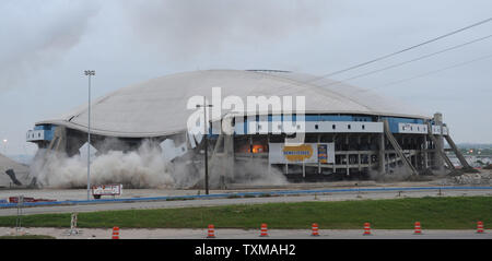 Texas Stadium, the former home of the Dallas Cowboys for 37 years, is imploded April 11, 2010.  Crews drilled more than 2,800 holes in the columns at the Irving, Texas stadium and placed nearly 2,715 pounds of explosives into the structure for detonation.    UPI/Ian Halperin. Stock Photo