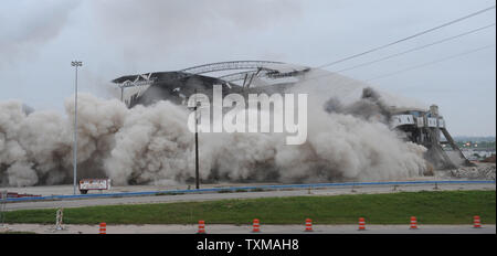 Texas Stadium, the former home of the Dallas Cowboys for 37 years, is imploded April 11, 2010.  Crews drilled more than 2,800 holes in the columns at the Irving, Texas stadium and placed nearly 2,715 pounds of explosives into the structure for detonation.    UPI/Ian Halperin. Stock Photo