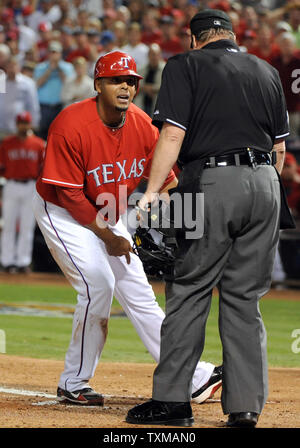 Texas Rangers Nelson Cruz spits tobacco after hitting during game