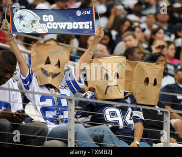 Dallas Cowboys fans wear paper bags as the Cowboys battle the