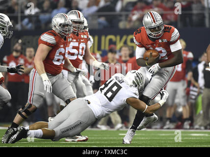Ohio State Buckeyes quarterback Cardale Jones is tackled by Oregon Ducks Eric Solis in the first half at the College Football Playoff National Championship, in Arlington, Texas on January 12, 2015. Photo by Kevin Dietsch/UPI Stock Photo