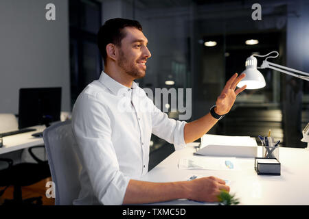 businessman using gestures at night office Stock Photo