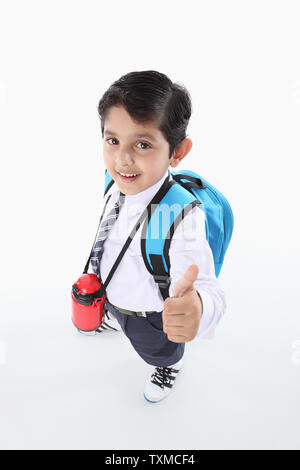 schoolboy showing thumbs up Stock Photo - Alamy