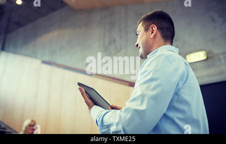 teacher with tablet pc at lecture hall Stock Photo