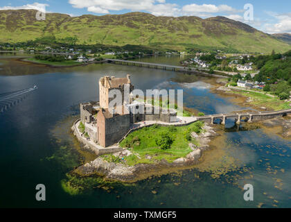 An aerial view of Eilean Donan Castle in the Scottish Highlands on a sunny day Stock Photo