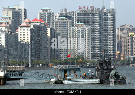 Chinese military patrol boats are stationed on the Yalu River across from North Korea in Dandong, China's largest border city with North Korea, in Liaoning Province, on May 30, 2015.  China remains North Korea's most important ally, providing Pyongyang with most of its food and energy supplies and comprises over sixty percent of its total trade volume.  North Korea's economic dependence on China continues to grow due to international sanctions, as indicated by the significant trade imbalance between the two countries.     Photo by Stephen Shaver/UPI Stock Photo