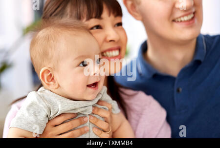 close up of happy mixed-race family with baby son Stock Photo