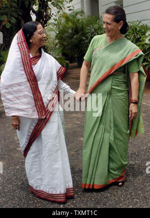 Congress party President and Chairman of India's ruling United Progressive Alliance Sonia Gandhi (R) welcomes Indian presidential nominee Pratibha Patil, 72, at her residence in New Delhi, India on June 16, 2007. India's governing coalition chose a woman as its presidential candidate Thursday, setting the stage for her to become the country's first female president. The post is largely ceremonial, though the president is the supreme commander of the armed forces and has the power to declare a state of emergency in times of political crisis.   (UPI Photo/Kamal Kishore) Stock Photo