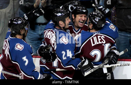 Colorado Avalanche right wing Dan Hinote (second from right) celebrates his first goal of the season with teammates (L-R) Karlis Skrastins, Antti Laaksonen, and John-Michael Liles at the Pepsi Center in Denver November 27, 2005.   Hinote's goal helped Colorado beat the Vancouver Canucks 6-2.  (UPI Photo/Gary C. Caskey) Stock Photo