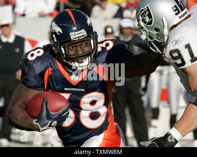 Denver Broncos Jeb Putzier lowers his shoulders before making contact with  New York Giants defender Brent Alexander. The New York Giants defeated the Denver  Broncos 24-23 in week 7 at Giants Stadium