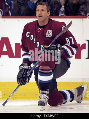 Colorado Avalanche center Pierre Turgeon, left, taps helmets with goalie David  Aebischer, of Switzerland, after Aebischer and the Avalanche shut out the  Nashville Predators 3-0 in an NHL hockey game in Denver on Tuesday, Jan. 3,  2006. (AP Photo/David