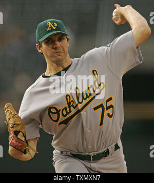 Barry Zito of the Oakland Athletics pitches during a 2002 MLB season game  against the Los Angeles Angels at Angel Stadium, in Anaheim, California.  (Larry Goren/Four Seam Images via AP Images Stock