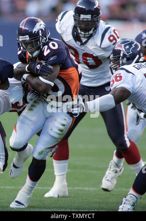 Denver Broncos running back Mike Anderson (L) is tackled by Philadelphia  Eagles linebacker Jeremiah Trotter (R) at Invesco Field at Mile High Staium  in Denver on October 30, 2005. (UPI Photo/Gary C.