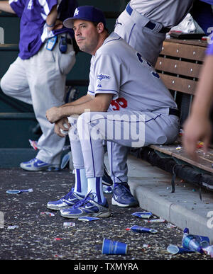 Los Angeles Dodgers pitcher Greg Maddux sits in the dugout as the Colorado Rockies have a seven run fourth inning at Coors Field in Denver September 28, 2006. The Dodgers came from behind and crushed the Rockies winning 19-11.    (UPI Photo/Gary C. Caskey) Stock Photo