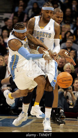Toronto Raptors guard Jose Calderon (8) looks for teammate while guarded by  Denver Nuggets guard Allen Iverson during the third quarter at the Pepsi  Center in Denver on March 14, 2008. Denver