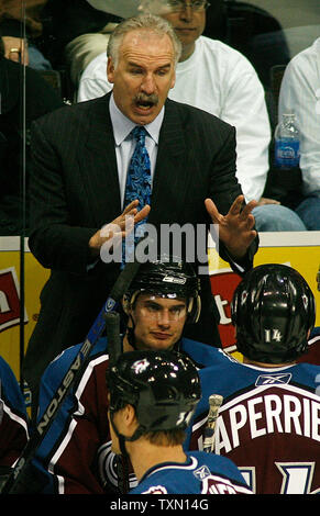 Colorado Avalanche head coach Joel Quenneville (top) gestures during third quarter timeout against the Anaheim Ducks at the Pepsi Center in Denver February 13, 2007.  Colorado shutout Anaheim 2-0.   (UPI Photo/Gary C. Caskey) Stock Photo