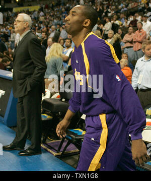 Los Angeles Lakers guard Kobe Bryant (R) walks past his head coach, Phil Jackson, prior to the start of game against the Denver Nuggets at the Pepsi Center in Denver April 9, 2007.  Denver currently holds the Western Conference's  sixth playoff spot with Los Angeles in seventh position.    (UPI Photo/Gary C. Caskey) Stock Photo