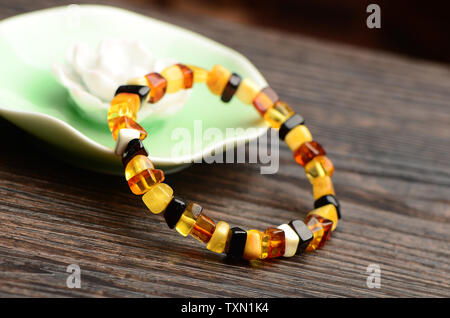 Amber beeswax bracelet Stock Photo