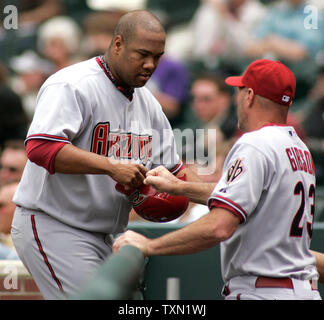 Arizona Diamondbacks bench coach Kirk Gibson leads the way as he instructs  Miguel Montero in base running during spring training baseball drills  Saturday, Feb. 24, 2007 in Tucson, Ariz. (AP Photo/M. Spencer