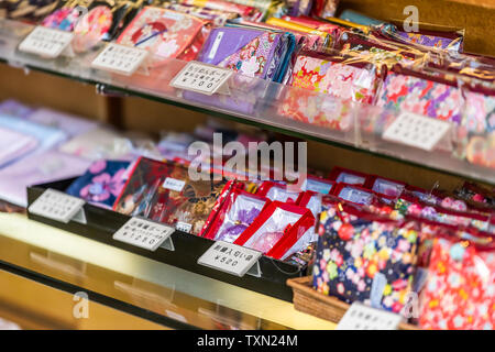 Kyoto, Japan - April 10, 2019: Kinkakuji temple or Golden Pavilion, Rokuonji zen buddhist temple souvenirs on display with sign and price Stock Photo