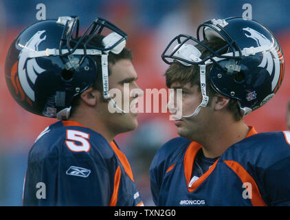 Denver Broncos starting quarterback Jay Cutler (R) and fourth string  quarterback Preston Parsons wait for drills to begin before preseason game  three at Invesco Field at Mile High in Denver on August