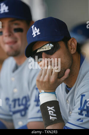 Los Angeles Dodgers Nomar Garciaparra (R) waits for start of game against the Colorado Rockies at Coors Field in Denver on September 20, 2007.  Colorado swept Los Angeles winning the final game 9-4.  (UPI Photo/Gary C. Caskey) Stock Photo