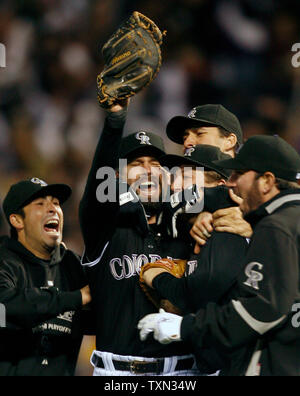 FILE - Colorado Rockies first baseman Todd Helton (17) celebrates after he  made the last out to win Game 4 of the National League Championship  baseball series against the Arizona Diamondbacks, 6-4