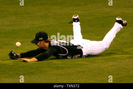 Colorado Rockies center fielder Cory Sullivan is unable to find the ball on  a triple by the Chicago Cubs' Jim Edmonds in the second inning. The Cubs  defeated the Rockies, 5-3, at