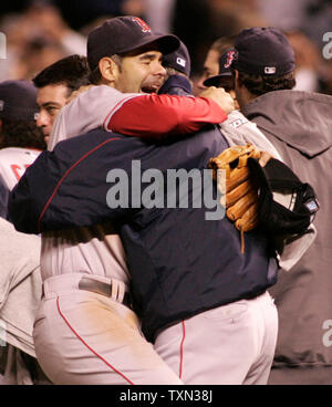 Boston Red Sox Series MVP Mike Lowell and teammate Alex Cora celebrate  after the World Series game four at Coors Field in Denver on October 28,  2007. The Boston Red Sox beat