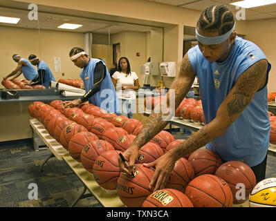 Denver Nuggets forward Carmelo Anthony, left, and guard Allen Iverson as  they report for training camp in Denver on Monday, Sept. 29, 2008. After  shedding the salaries of two players during the