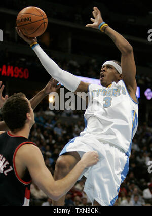 Denver Nuggets guard Allen Iverson (R) drives against Portland Trailblazers guard Sergio Rodriquez of Spain during the first half at the Pepsi Center in Denver on November 14, 2007. (UPI Photo/Gary C. Caskey) Stock Photo