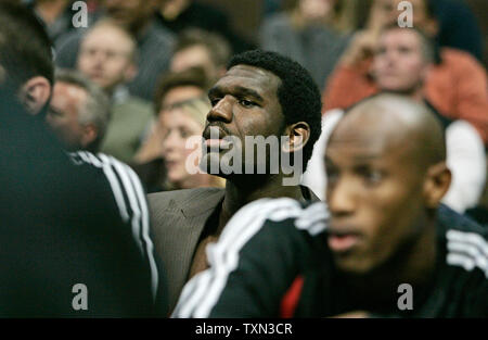 The NBA's number one draft choice Portland Trailblazers center Greg Oden (C) from Ohio State watches play against the Denver Nuggets from behind the bench at the Pepsi Center in Denver on November 14, 2007. (UPI Photo/Gary C. Caskey) Stock Photo